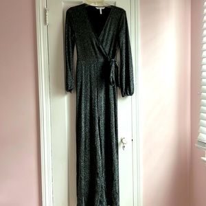BCBGENERATION black and silver jumpsuit. A wrap style v-neck top with wide legs
